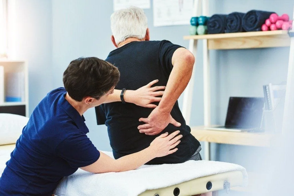 Physical therapist treating a patient at Elite Rehab Solutions